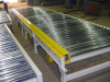 Power roller skid conveyor