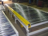 Power roller skid conveyor